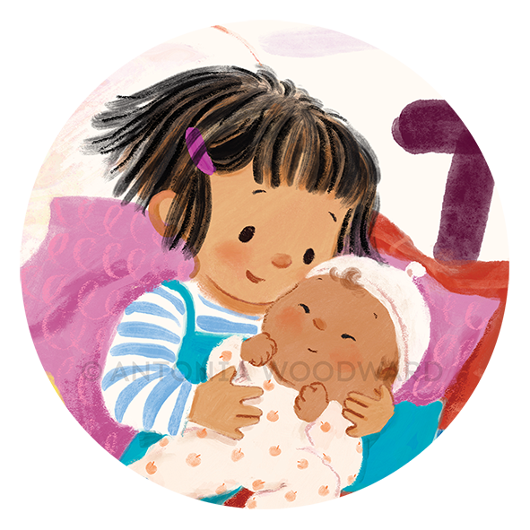 A close up of a smiling big sister holding her new baby sibling